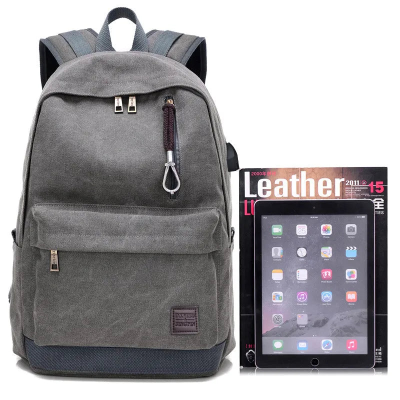 Canvas backpack with integrated USB charging port, offering a 44x32x17cm main compartment with dedicated 15-inch laptop sleeve and zipper pocket organisation