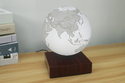 Levitating Earth or Jupiter lamp floating above base with LED illumination