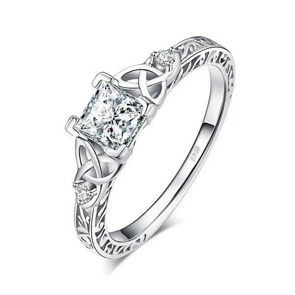 Elegant crystal engagement ring with constellation-inspired design and sparkling white steel accents