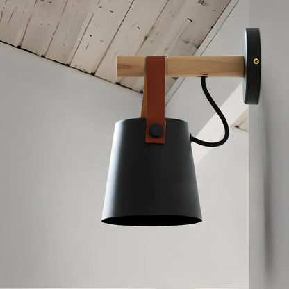 Scandinavian wall lamp with iron shade measuring 220mm by 130mm in black finish