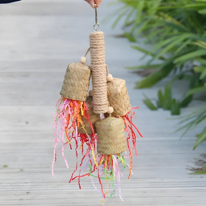 Wooden parrot chew toy with colourful shredded paper measuring 15x35cm