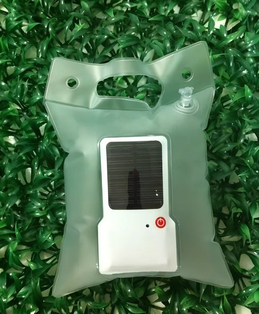 White solar inflatable LED camping light showing 310mm diameter when inflated with integrated solar panel