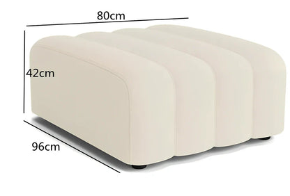 Off-white curved modular sofa with fleece fabric in corner configuration showing multiple connected pieces