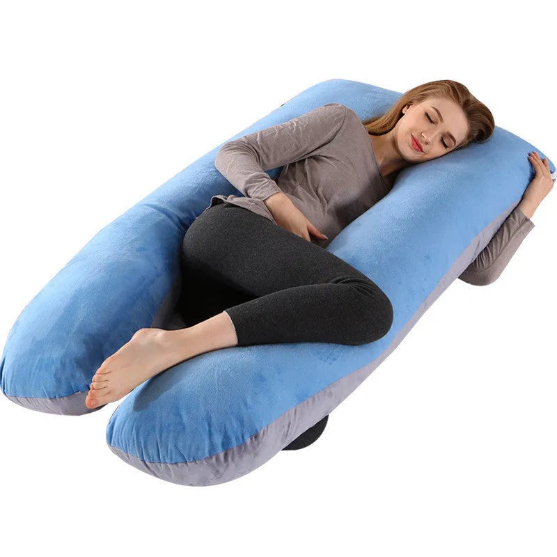 Large U-shaped pregnancy support pillow with removable cover and abdominal support belt.