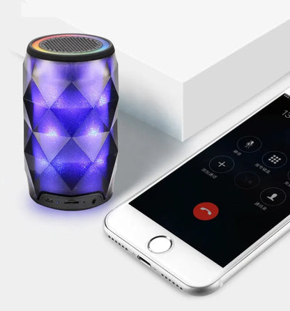 Black crystal diamond-cut Coke can shaped Bluetooth speaker with colourful starry sky LED lighting.