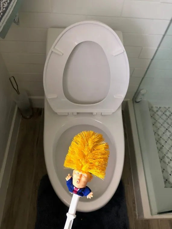 Yellow Donald Trump novelty toilet brush with hanging slot in handle