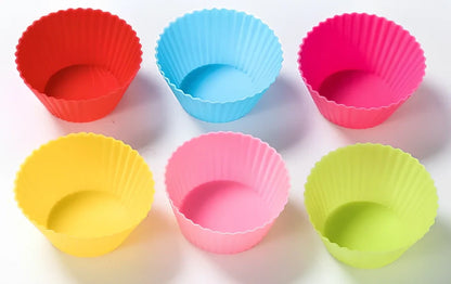Six different coloured silicone cupcake liners showing fluted edges and nonstick surface