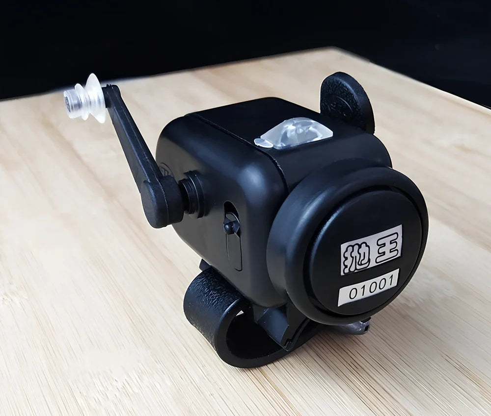 Black sea fishing bite alarm with ABS shell and polymer mounting belt for rod attachment