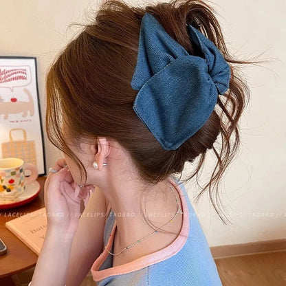 Handmade fabric bow hair grip with triangle grip design and plastic hairpin