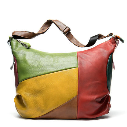 Cowhide leather crossbody bag showing its size, suitable for carrying a 15-inch laptop and A4 documents.