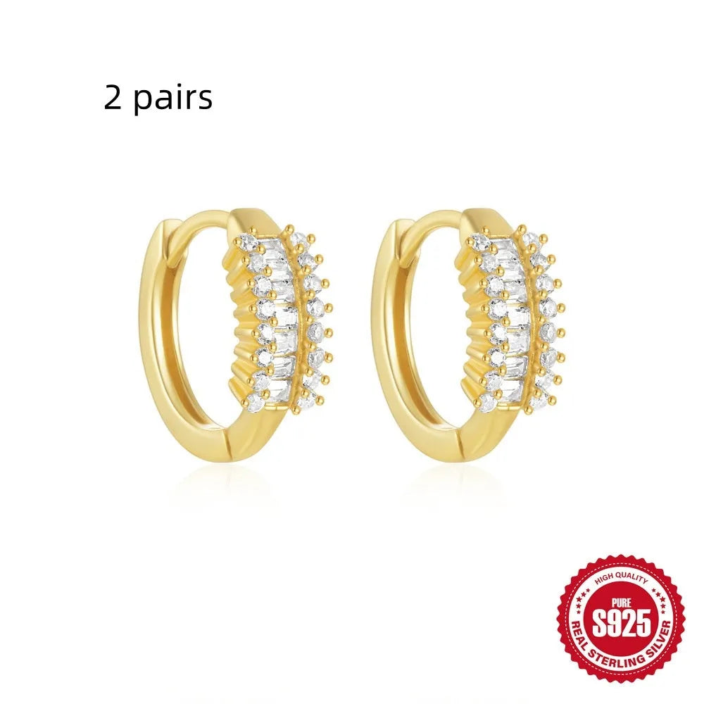 Sterling silver geometric stud earrings with small round diamond accents in gold or silver finish