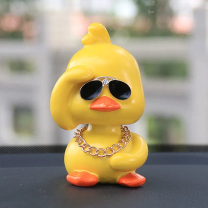 Little yellow duck resin car interior ornament in social duck poses with gold glasses and gold necklace