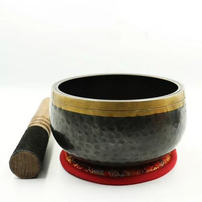 Black and gold copper meditation sound bowl with leather rod and thin pad