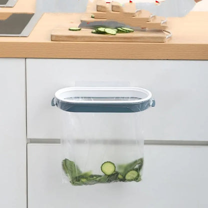 Blue or pink plastic kitchen garbage bag storage rack mounted on a cabinet or bench for organising carrier bags
