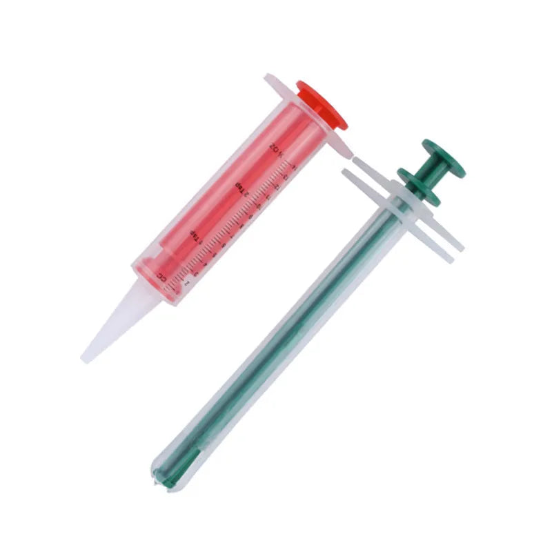Two silicone pet pill shooters with soft tips for cat and dog medication.