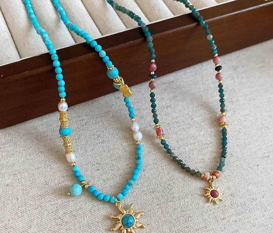 French court style freshwater pearl necklace with stone sun pendant on clavicle chain