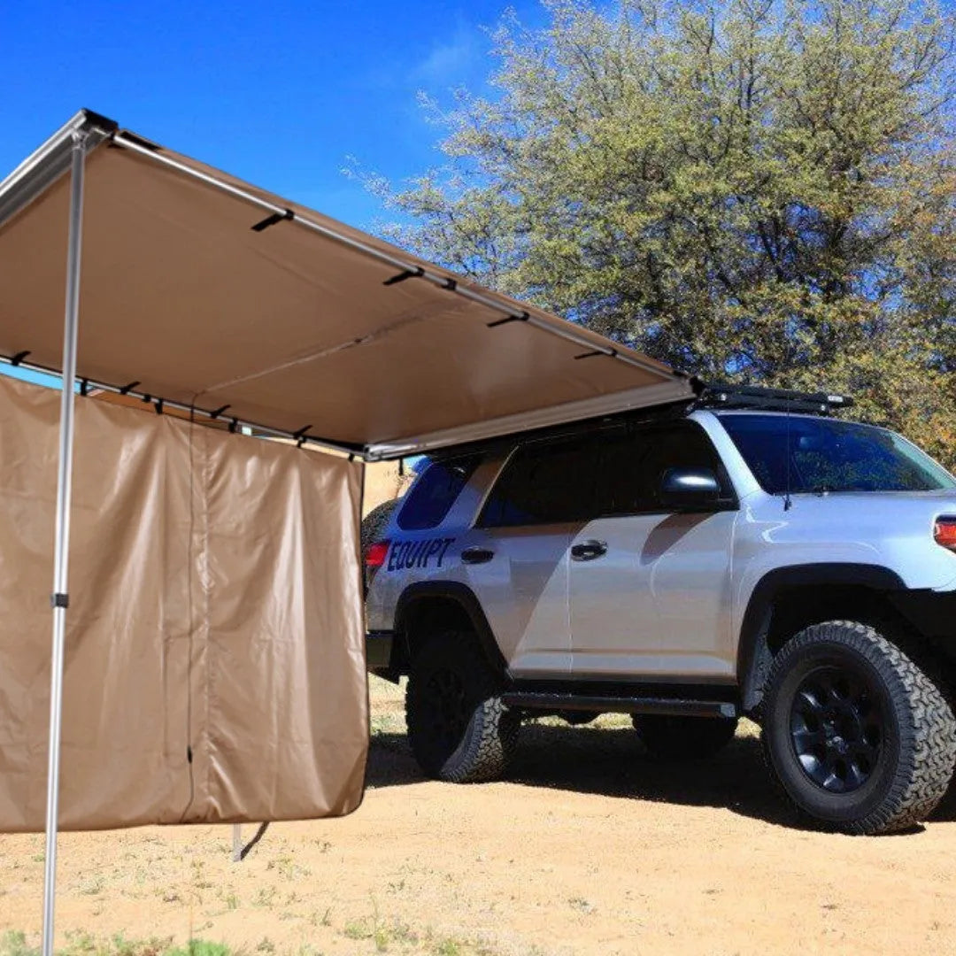 Black glue coated car sunshade tent with aluminium poles set up outdoors.