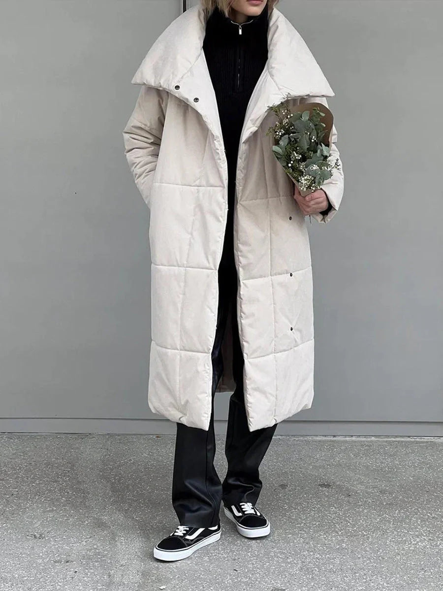 Cozy women's long winter coat with large lapel, lace-up design, and pockets for optimal warmth and style
