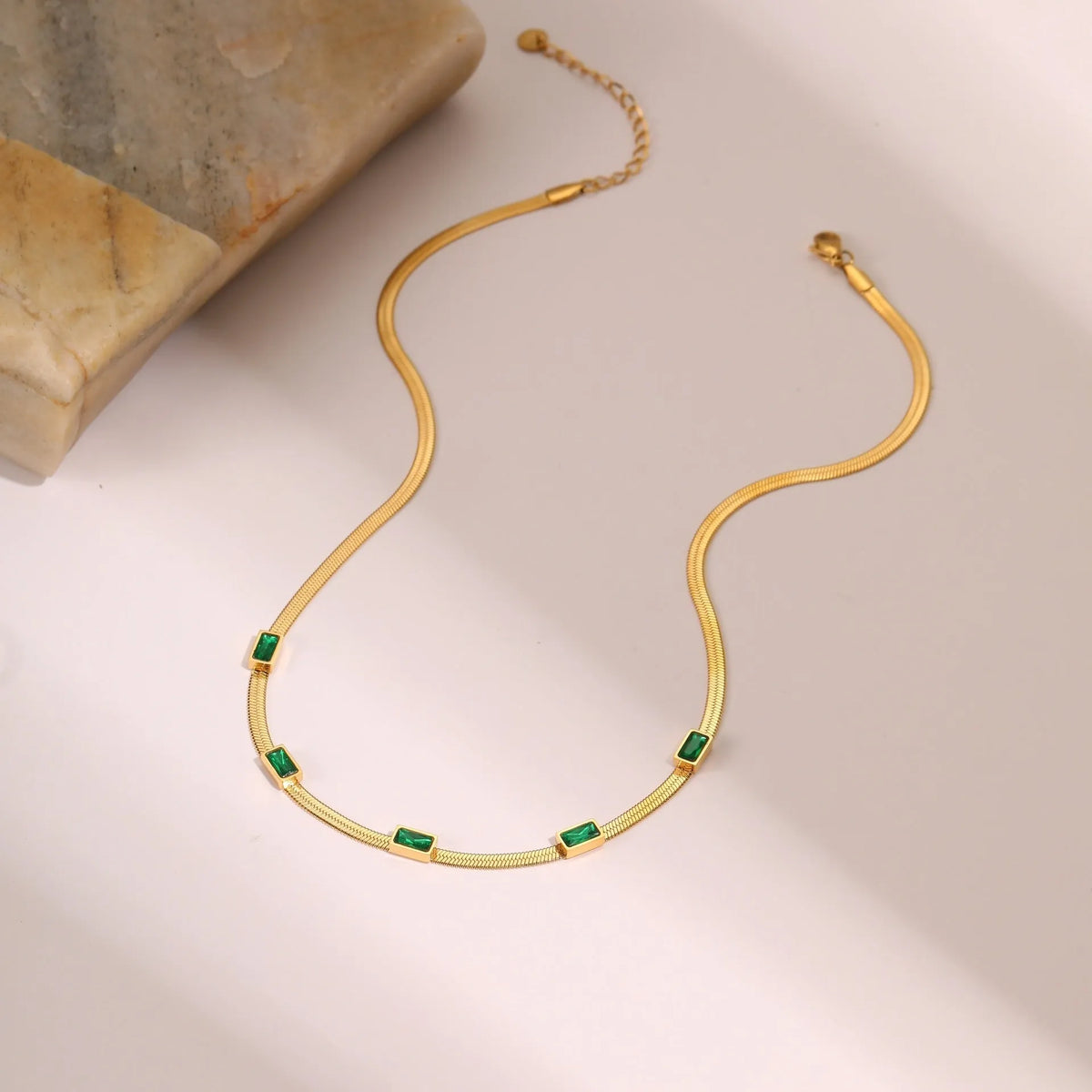 Retro geometric square zircon necklace with stainless steel construction and 18K gold plating on flat snake chain