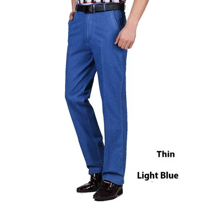 Men's high waist loose fit blue jeans on a hanger showing zip fly and casual style.