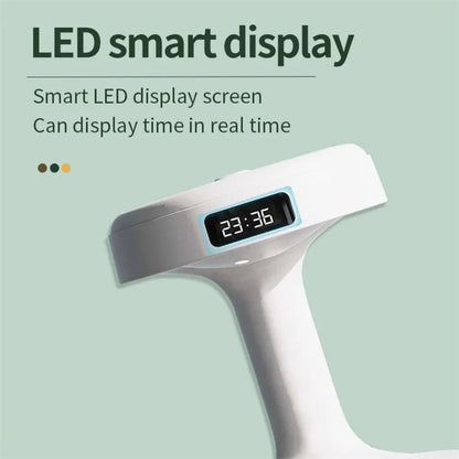 White columnar anti-gravity humidifier with LED clock display on a wooden desk