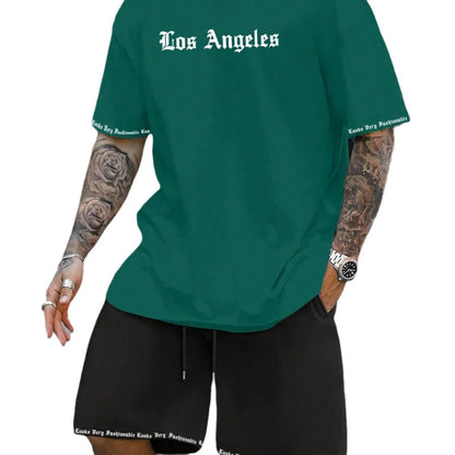 Man wearing a grey short-sleeve sports top and matching shorts from the quick-dry polyester set.