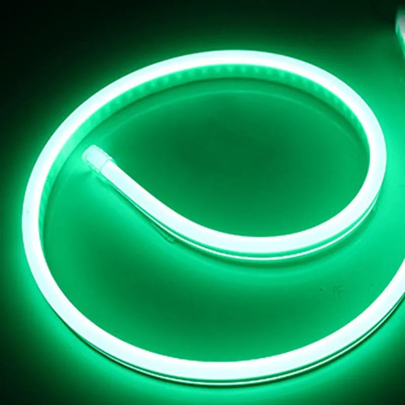 Close-up of flexible blue silicone LED neon strip showing dense LED beads, coiled on a 100-metre reel.