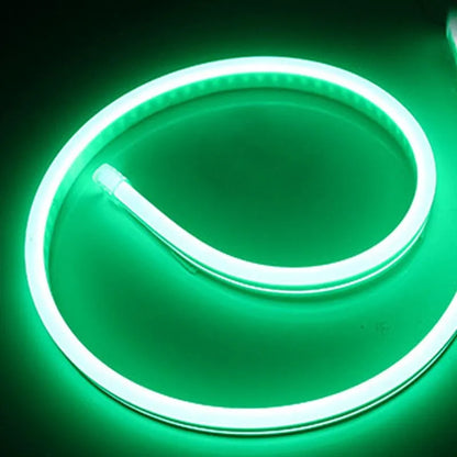 Close-up of flexible blue silicone LED neon strip showing dense LED beads, coiled on a 100-metre reel.