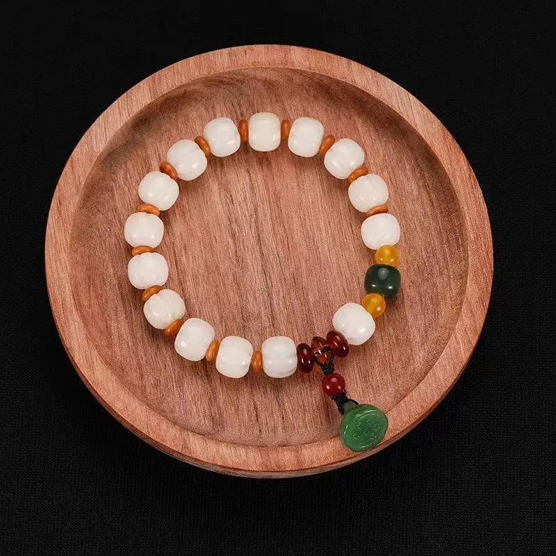 White Bodhi root bracelet with carved pumpkin lotus beads including Apple Orchard and Duobao styles