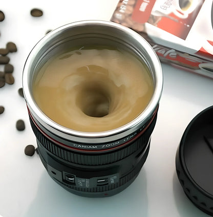 Self-stirring camera lens mug with stainless steel construction and automatic mixing button