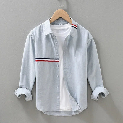 Hong Kong style loose cotton blend cardigan shirt in light blue on a hanger