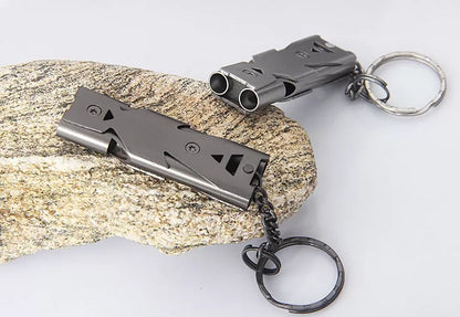Durable metal keychain whistle in silver and black, compact design for safety