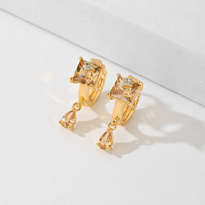 Trendy copper-plated gold fashion earrings with water droplet design in multiple colors.