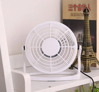 Black mini USB fan with adjustable angle mechanism and 96mm blades on desk