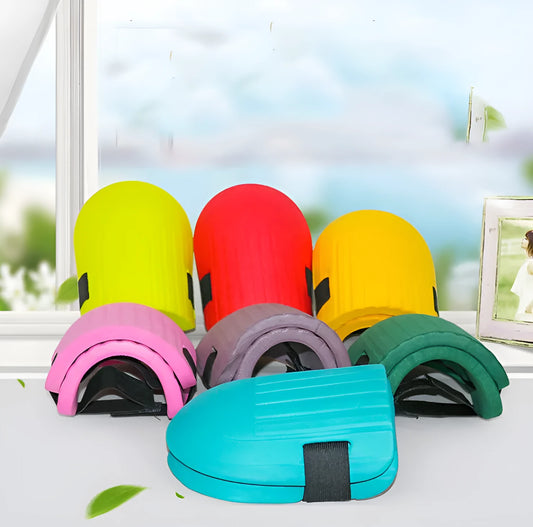 A pair of rectangular EVA foam knee pads in army green colour, placed on a garden soil background.
