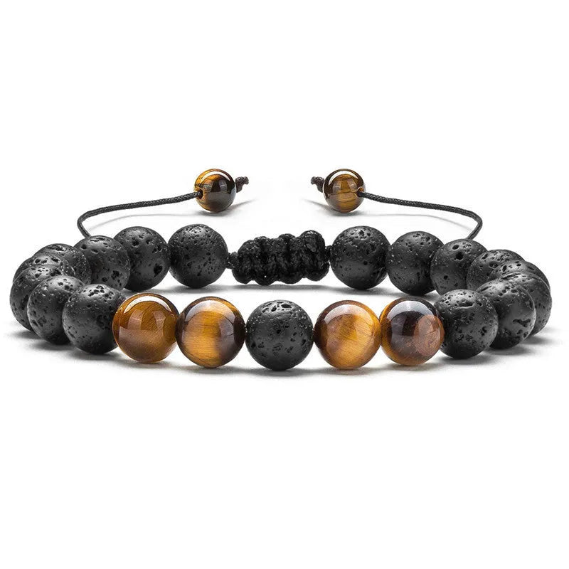 Tiger Eye and black agate geometric couple bracelets laid out as a matching set.