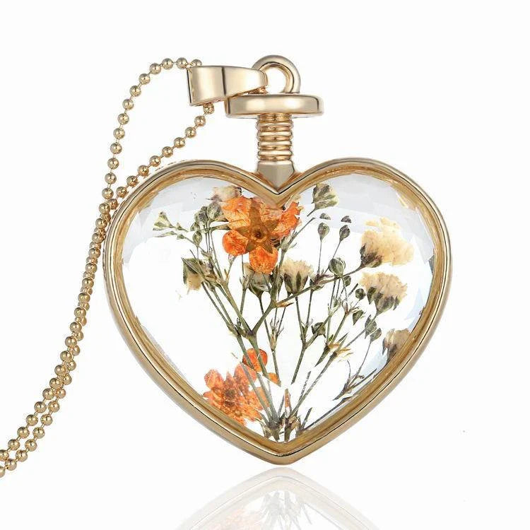 Elegant round pendant necklace with dried flower specimen in various colors including yellow, blue, purple, red, and orange