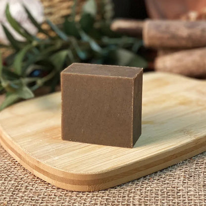 72g bar of nine grass cold process shampoo soap on a plain background.
