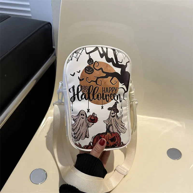 Halloween graffiti print crossbody bag in black with pumpkin, ghost, and bat designs, measuring 14x23x9.5cm
