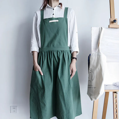 Sleeveless cotton kitchen apron in blue colour showing front coverage and adjustable neck strap