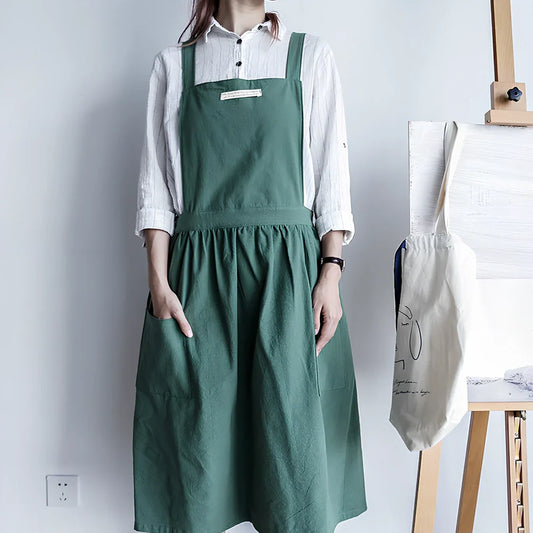 Sleeveless cotton kitchen apron in blue colour showing front coverage and adjustable neck strap