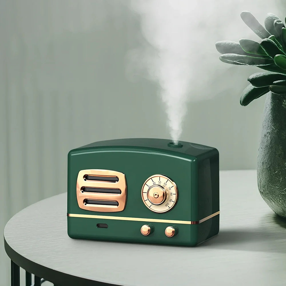 Green retro humidifier with bronzing finish measuring 9.5cm tall on wooden desk
