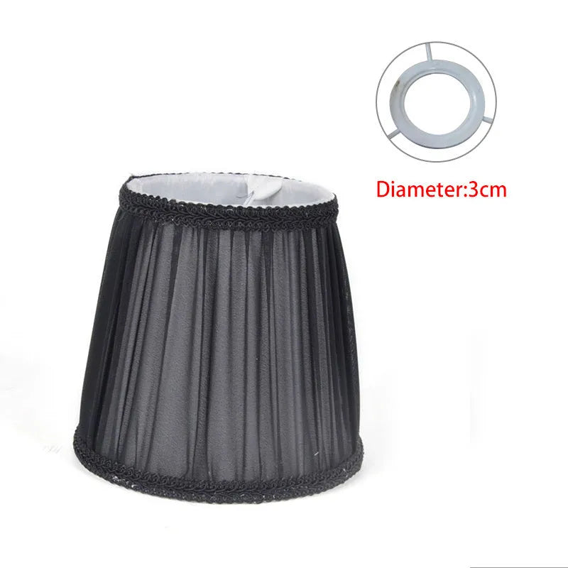 Crystal wall lamp with fabric cloth lampshade in six colour variations showing black, white and dark blue options