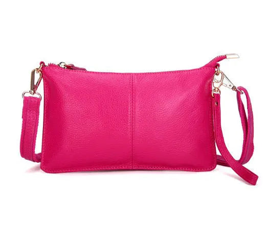 Lady's cowhide slant bag in apricot colour showing front view with strap and compact 24 cm size.