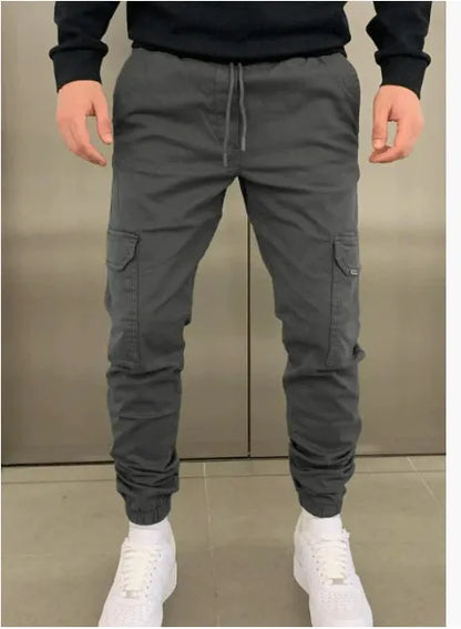 Men's loose-fit casual trousers with elastic waistband and patch pockets in army green colour