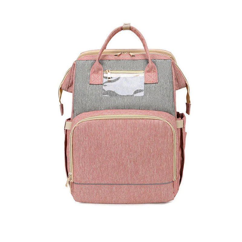 Versatile baby changing backpack with USB charging port and folding portable bed