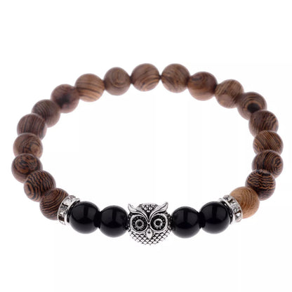 Owl frosted stone lifeline wood grain bracelet in black and gold, featuring wood beads and alloy stone