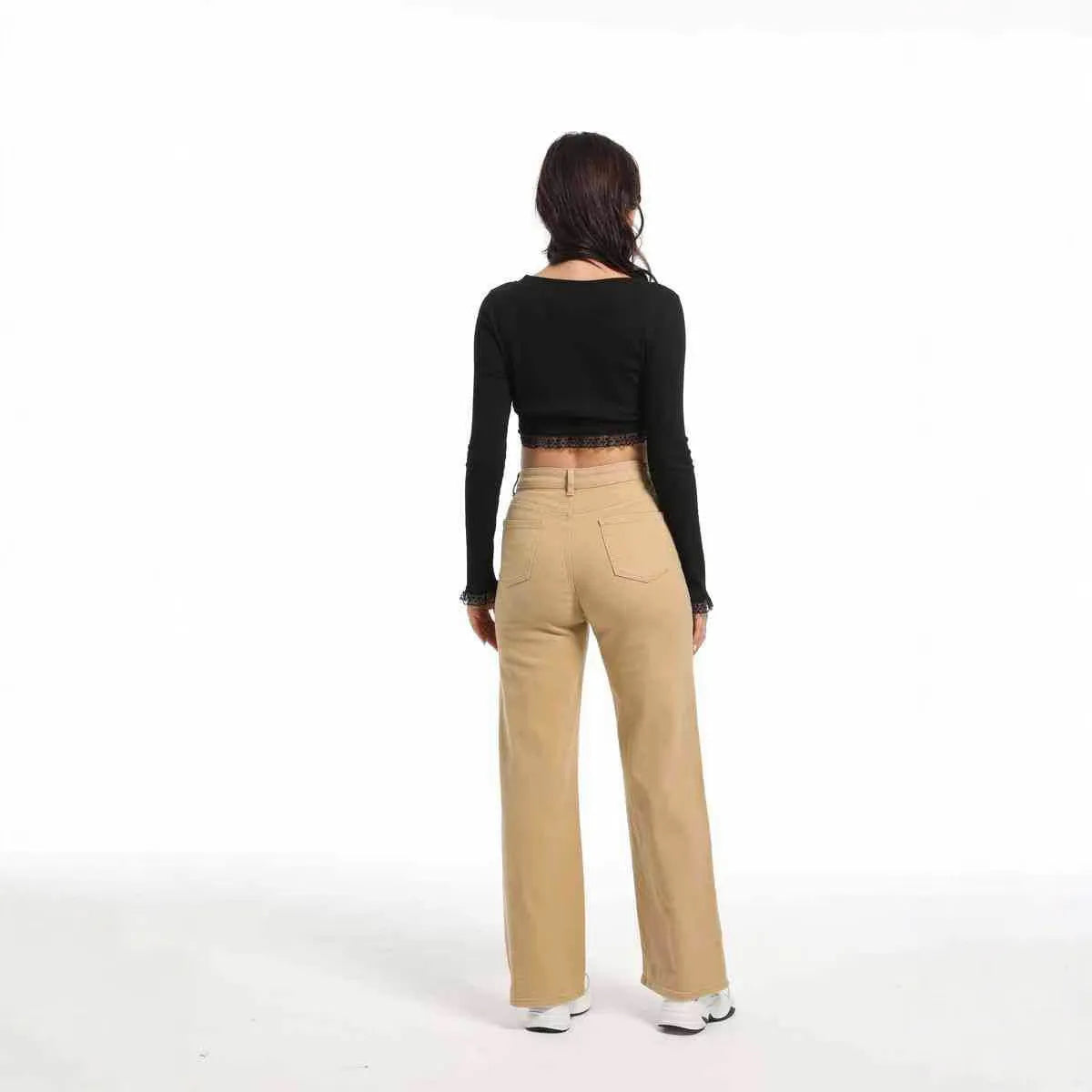 Women's autumn straight jeans in apricot colour showing high waist design and wide leg cut on mannequin