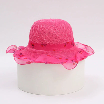 Children's princess straw hat with floral accents and wide brim for sun protection