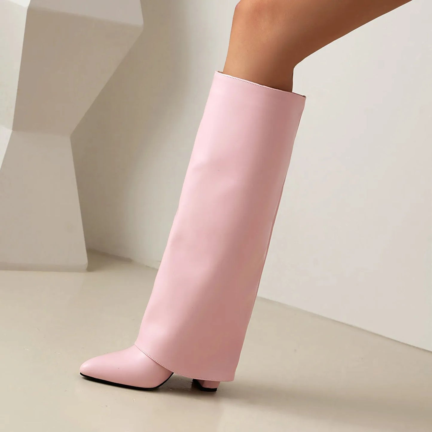 Women's plus size black high heel boot with high shaft and sewing line detailing on artificial PU material.